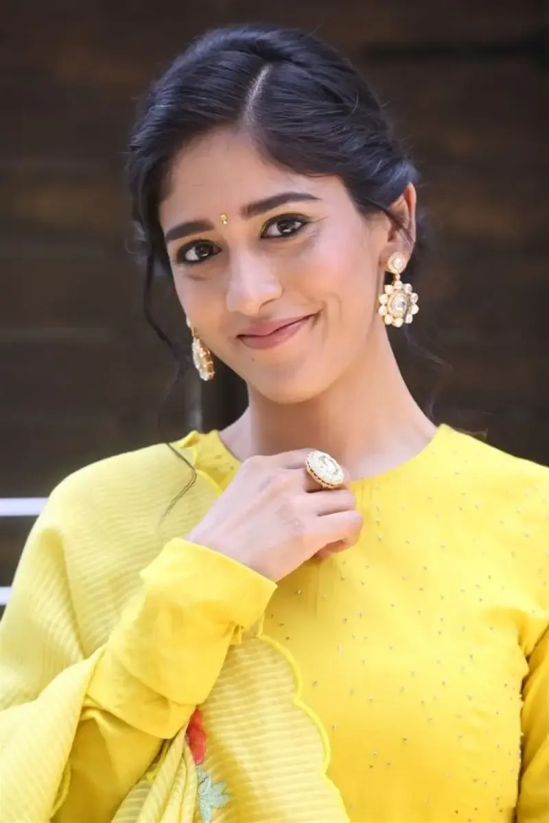 ACTRESS CHANDINI CHOWDARY IN YELLOW DRESS AT MOVIE TEASER LAUNCH 9